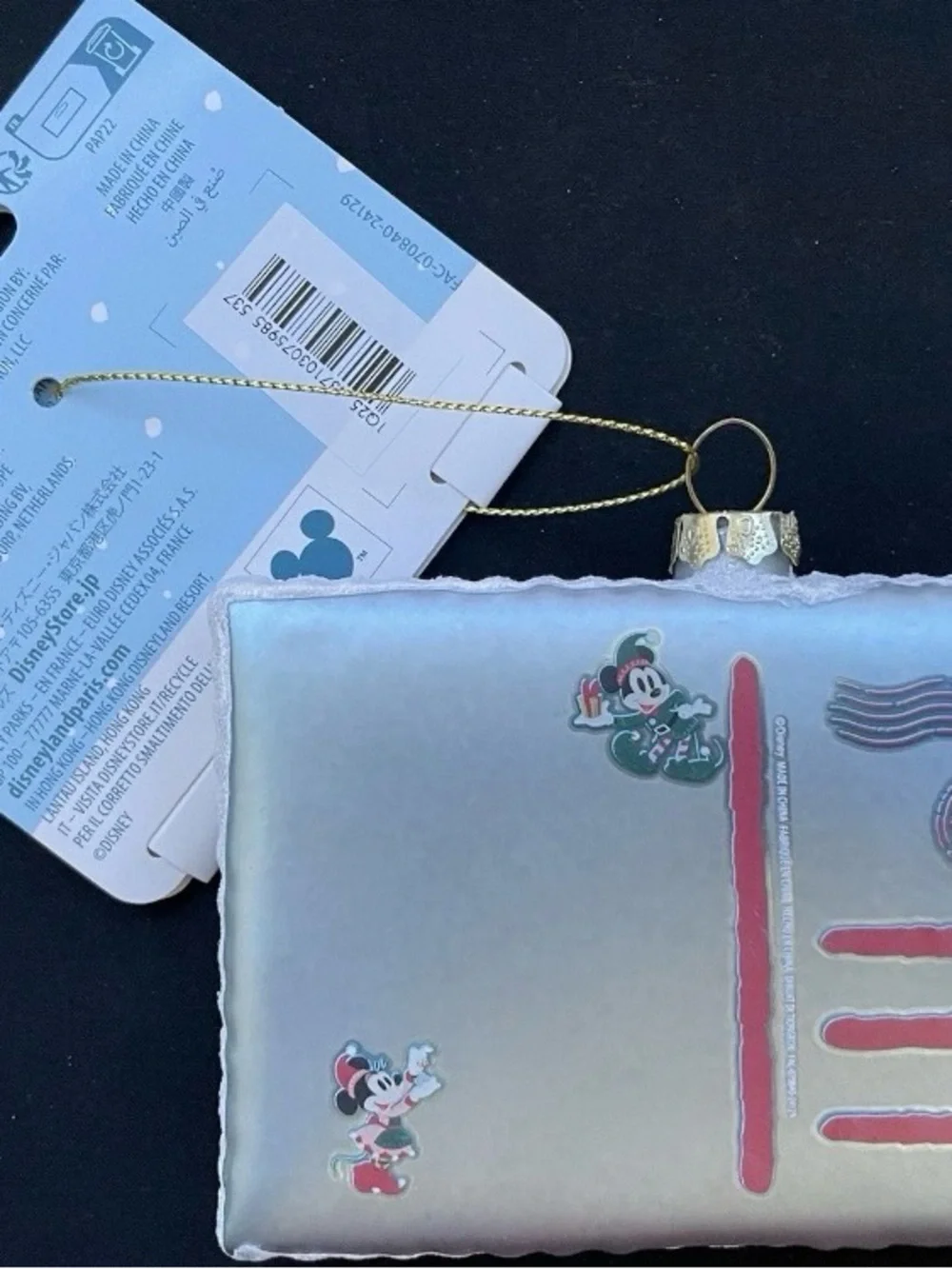 Disney Silver Holiday Ornament with Red and Green Accents